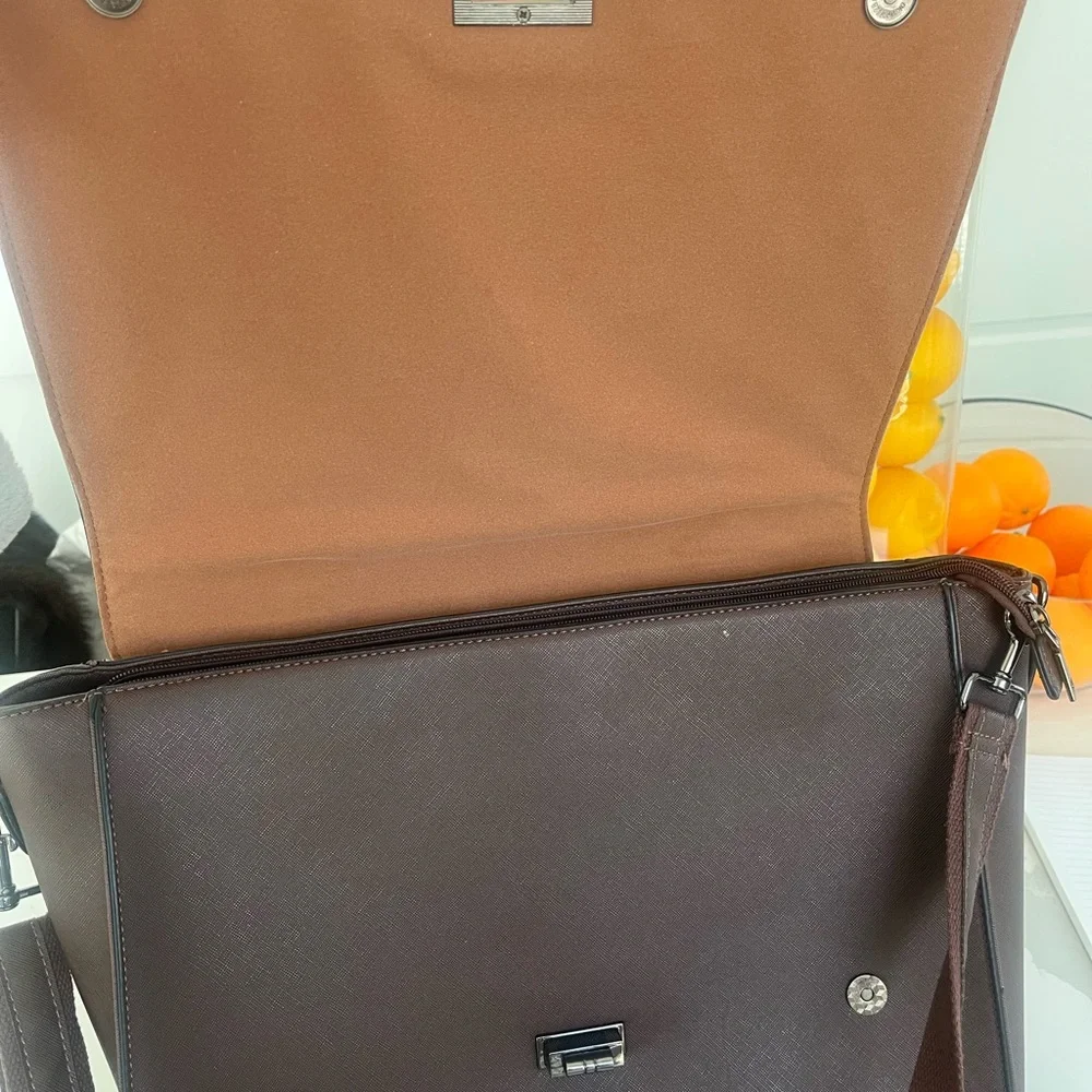 Brown Leather Briefcase with Adjustable Straps and Top Handle